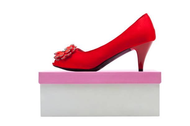 Women's Red fashion middle heels shoes. On a shoe box.