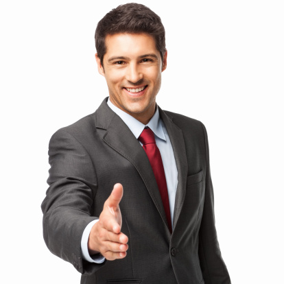 Businessman giving a handshake in front of white background