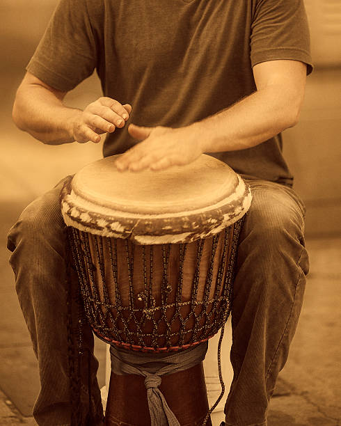 istock street percussionist playing african drum 155431570