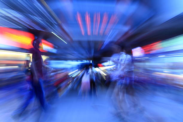 Night Crowds in the downtown area Zoom blur on crowds of pedestrians walking in the downtown area shenzhen technology stock pictures, royalty-free photos & images