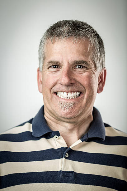 Man with Cheesy Grin Man with Cheesy Grin shallow depth of field cheesy grin stock pictures, royalty-free photos & images