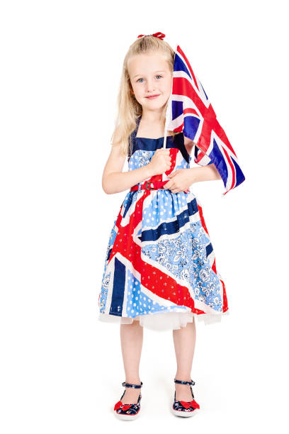 Adorable little girl with United Kingdom flag outdoors