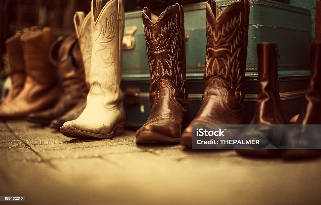 cowboy boots for sale second hand cowboy boots for sale - sepia processing Cowboy Boot Stock Photo