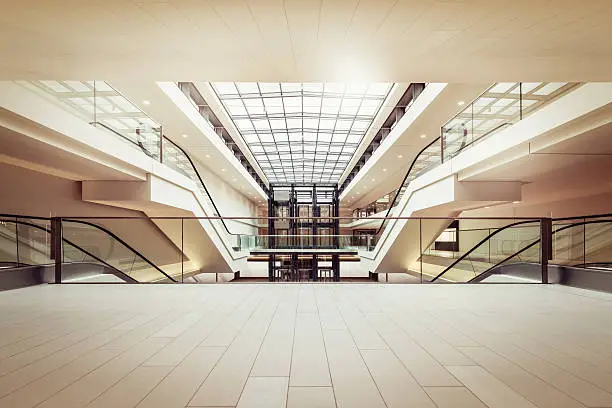 Photo of Escalators in a clean modern shopping mall