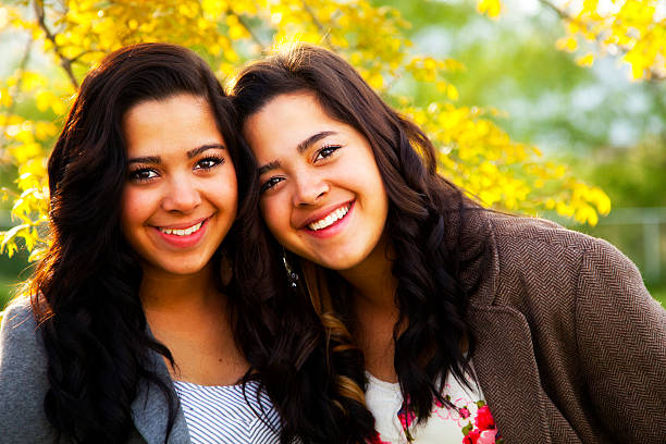 istock Confident Latina Twins in Colorful, Natural Setting 155432823