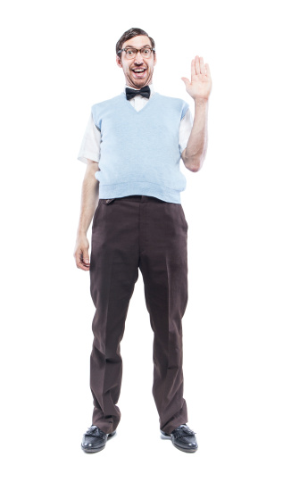 A greeting from a nerdy IT young man wearing a bow tie, blue sweater vest, and horn rimmed glasses, making a happy, goofy face as he waves his hand in greeting.  Vertical isolated on white background