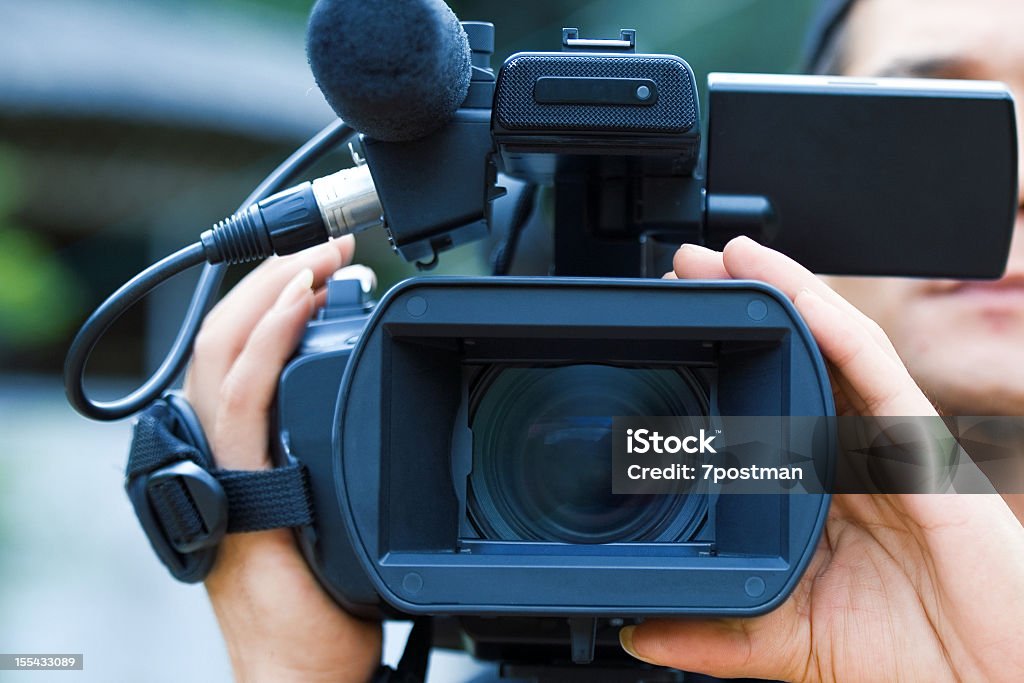 Close-up of a male videographers black camera Videographer Reality TV Stock Photo