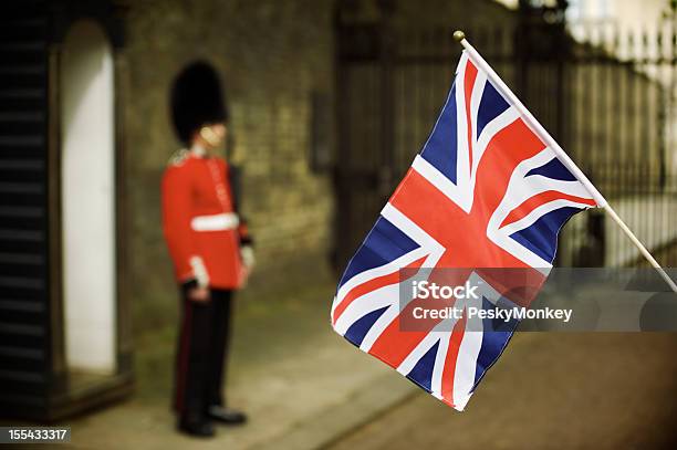 Union Jack Flag Waves Next To Soldier In Red Stock Photo - Download Image Now - Honor Guard, British Culture, Royalty