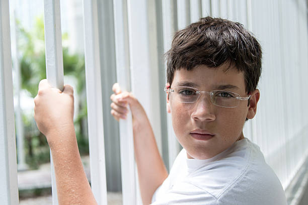 istock Pensive child looking at the camera 155433576