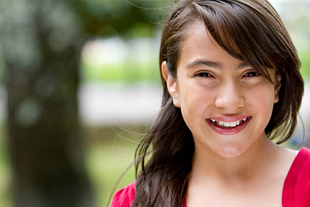 istock Girl smiling outdoors 155434023