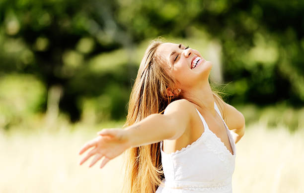 istock joyful carefree woman 155434386