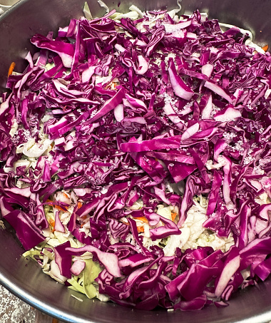 Chopped red organic cabbage is a common ingredient for dishes such as fermented sauerkraut and coleslaw.