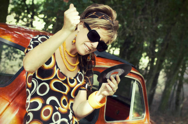 istock Woman looking a record. 1970s style. 155436741