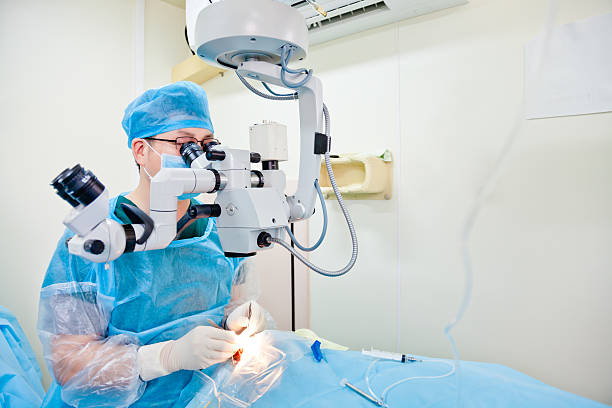 Cataract surgery Male doctor doing cataract surgery in operating room eye surgery photos stock pictures, royalty-free photos & images