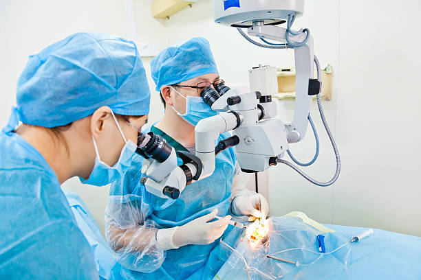 Cataract surgery two doctor doing cataract surgery in operating room eye surgery photos stock pictures, royalty-free photos & images