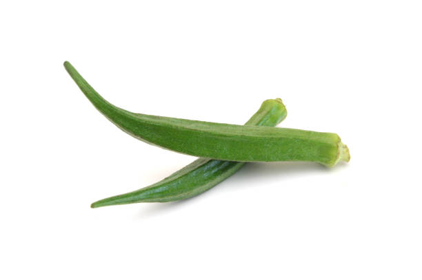 istock Fresh okra isolated in plate on a white background 1554371322