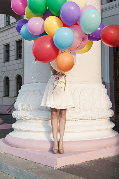 istock woman with balloons 155437353