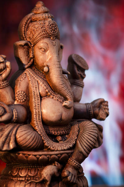 istock Deity of Ganesha from India on red background 155437367
