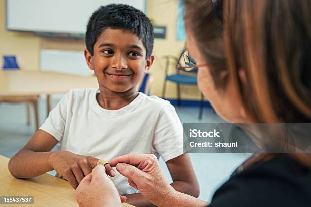 First Aid In The Classroom Stock Photo - Download Image Now - First Aid, Child, Education
