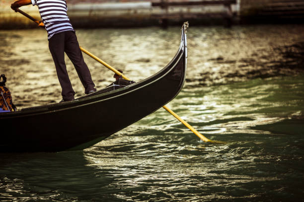 Venice: Gondolier One of the many hundreds of gondoliers working on the canals of Venice. gondolier stock pictures, royalty-free photos & images