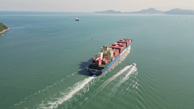 Boat accompanying cargo ship