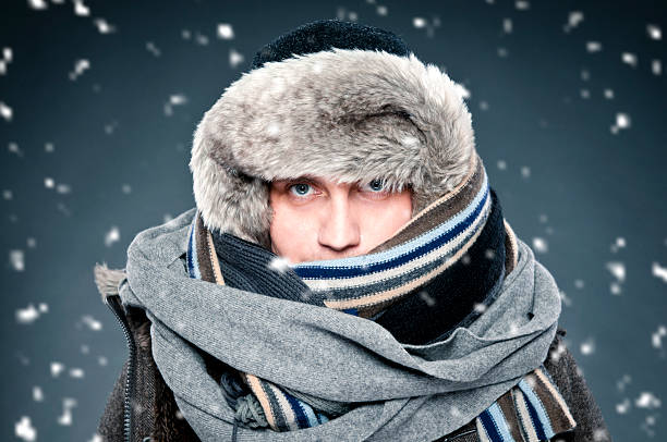 istock Man tightly bundled up in winter clothes, shawl, fur cap 155437954