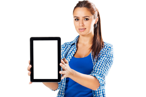 Portrait of a cute young woman presenting digital tablet with blank screen