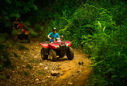 kid driving an all terrain vehicle (atv) in costa rica\n\n[url=http://www.istockphoto.com/search/lightbox/12629267#190d0664][img]http://conceptocommunications.com/isbanners/banner-template-costaricaadventures.jpg[/img][/url]