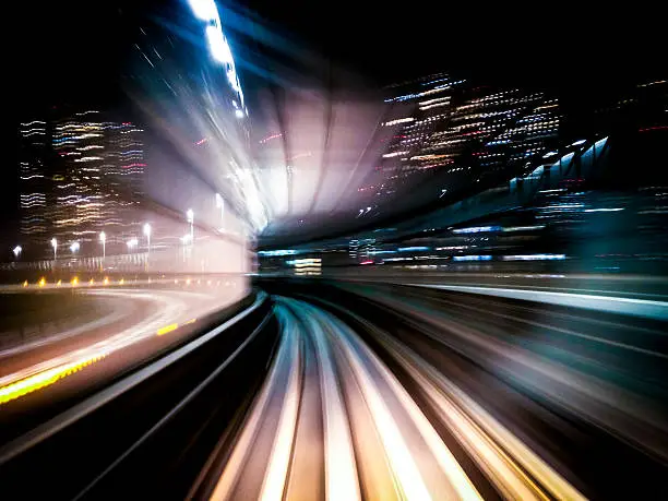 Motion blur image of Tokyo Transit System Line by night - blur of motion of train through a tunnel. 