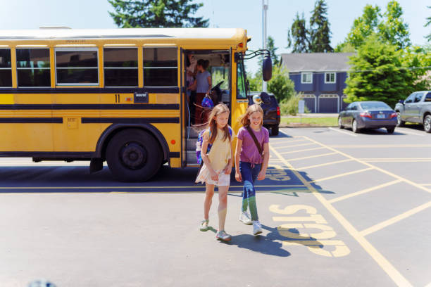 istock Friends arriving at school together 1554383433