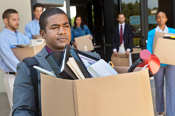 istock Group of professionals leaving office after layoff or being fired 155438792