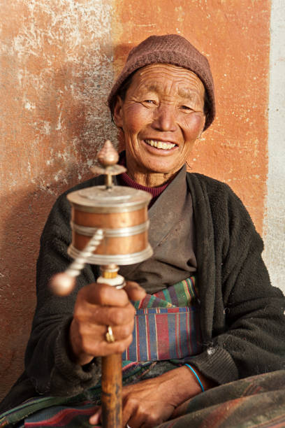 istock Tibetan woman praying, Mustang 155438830