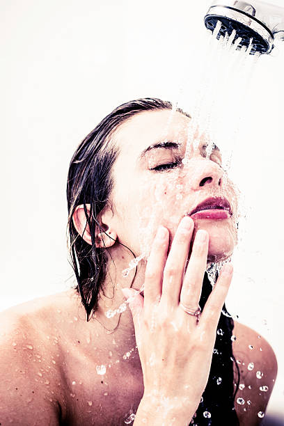 istock Woman under shower 155438833