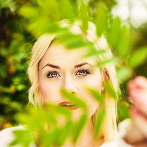 istock Beautiful woman with a leaf 155438920