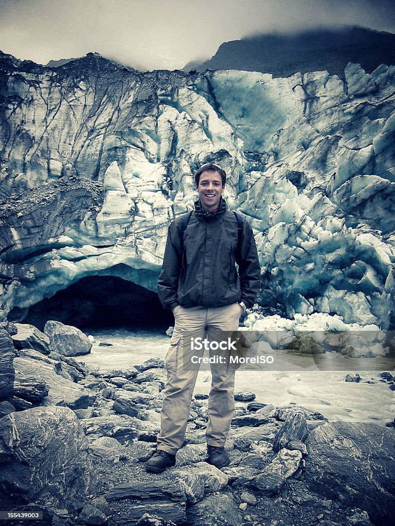 Man at Fox Glacier Man standing on the rocks at Fox Glacier in New Zealand. Glacier Stock Photo