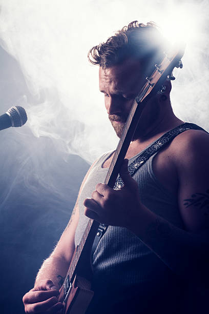 istock Rocker in Concert Play Guitar 155439053