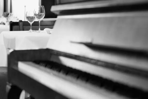 Piano bar, restaurant.  Selective focus. Very shallow depth of field for soft background.