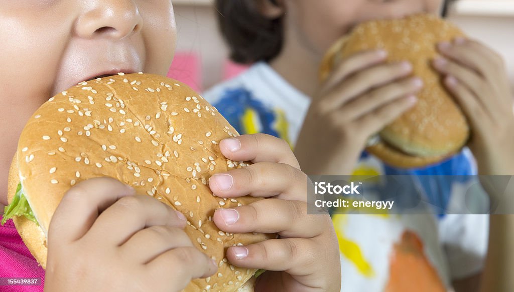 Boy And Girl With Hamburgers Boy And Girl With Hamburgers.  "the t-shirt painted by himself" Child Stock Photo