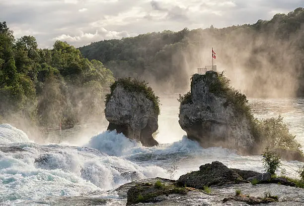 View at the Rhine falls in Schaffhausen at sunset. Toned back lit picture.