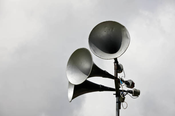 istock Old fashioned loudspeakers against grey skies 155440381