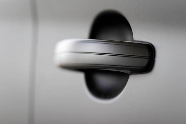 istock Black car doorhandle close up 155440459