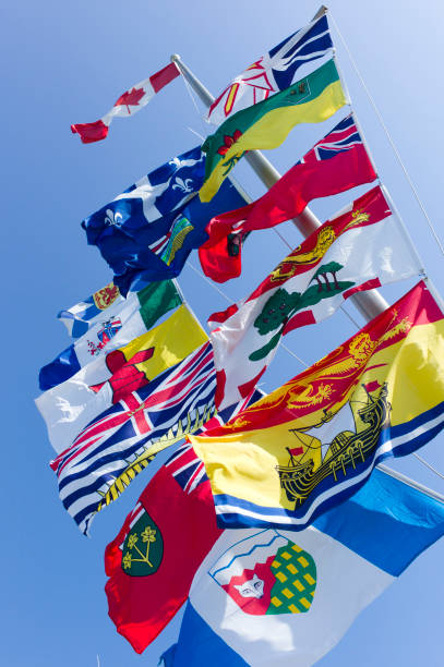 istock Canada's National, Provincial and Territorial Flags on One Pole. 155440463