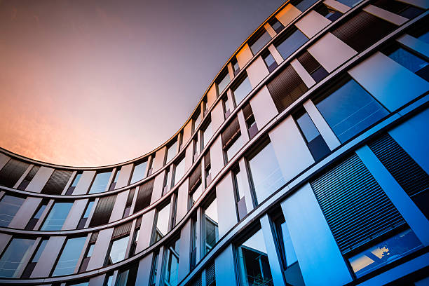 Modern Office Architecture Glass facade of a modern office building in Hamburg, Germany. architectural feature stock pictures, royalty-free photos & images