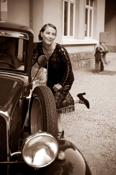 istock Woman at a Vintage Car 155440665