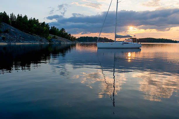 istock Sunset with sailboat at anchor in the archipelago 155440730