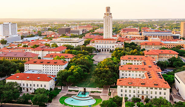 University of Texas (UT) Austin campus at sunset aerial view University of Texas Austin campus at sunset-dusk - aerial view bell tower tower photos stock pictures, royalty-free photos & images