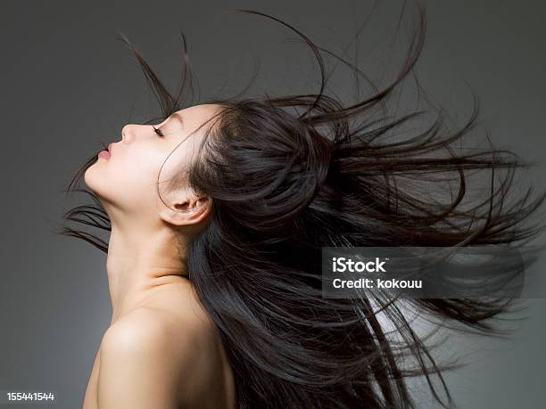 Profile Shot Of The Woman Who Looks Up Stock Photo - Download Image Now - Women, Fashion Model, Long Hair