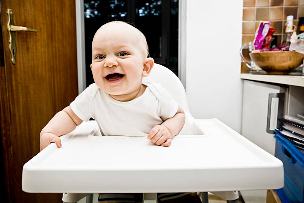 istock Baby in High Chair 155442034