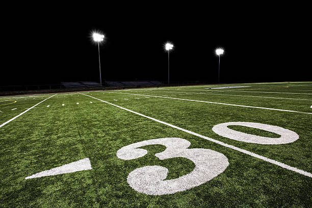 istock Football Field at Night 155442355
