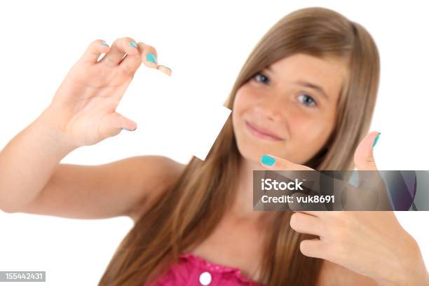 Young Woman Showing An Empty Business Card Stock Photo - Download Image Now - 10-11 Years, Brown Hair, Excitement